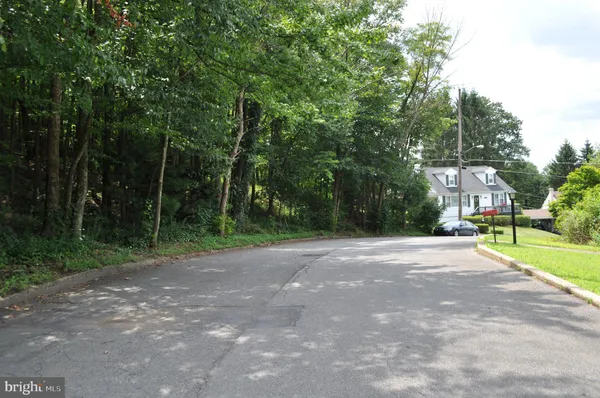 a view of a street with a building in the background