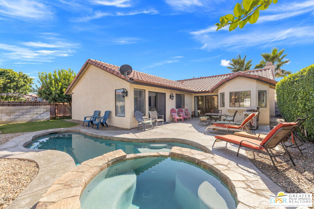 45688 Sutter Creek Road Indio, CA 92201 - Photo 1 of 51 a view of a house with swimming pool and sitting area