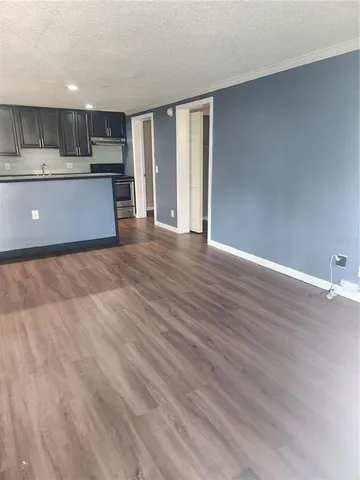 a view of a kitchen with a sink and a window