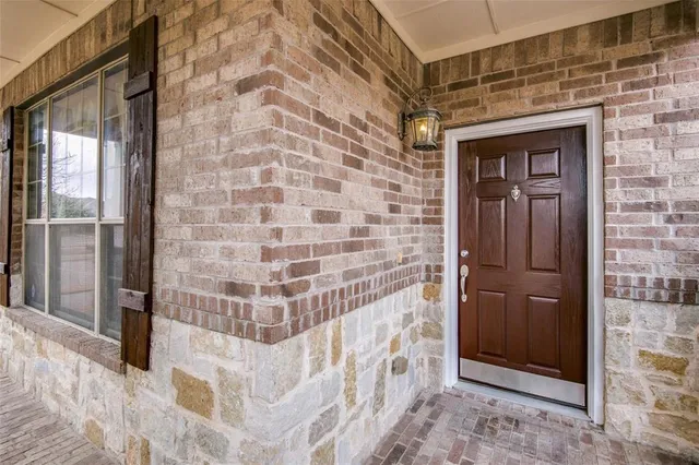 a bathroom with a shower and a door