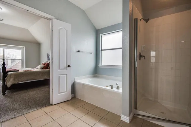 a bathroom with a double vanity sink a toilet and a mirror