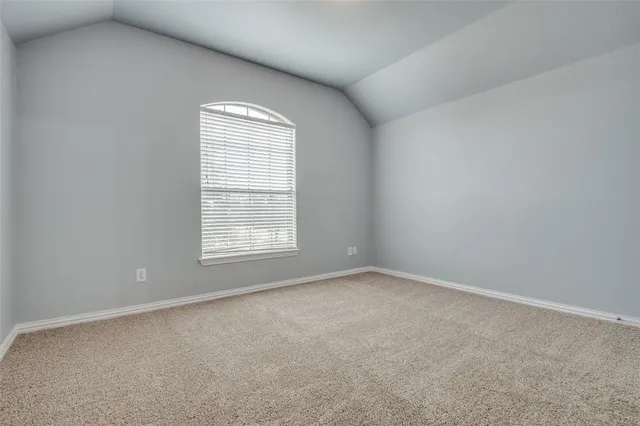 a en suite bathroom with a tub shower and window