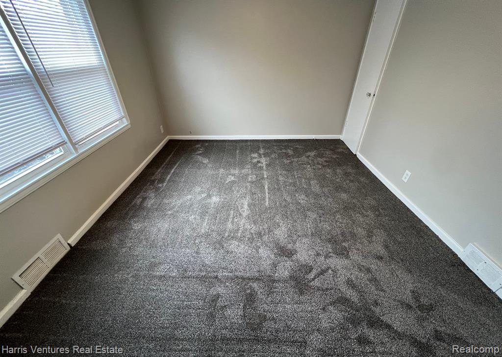 21534 Moross Road Grosse Pointe, MI 48236 - Photo 12 of 16 Bedroom #2 with carpeted flooring and light gray walls