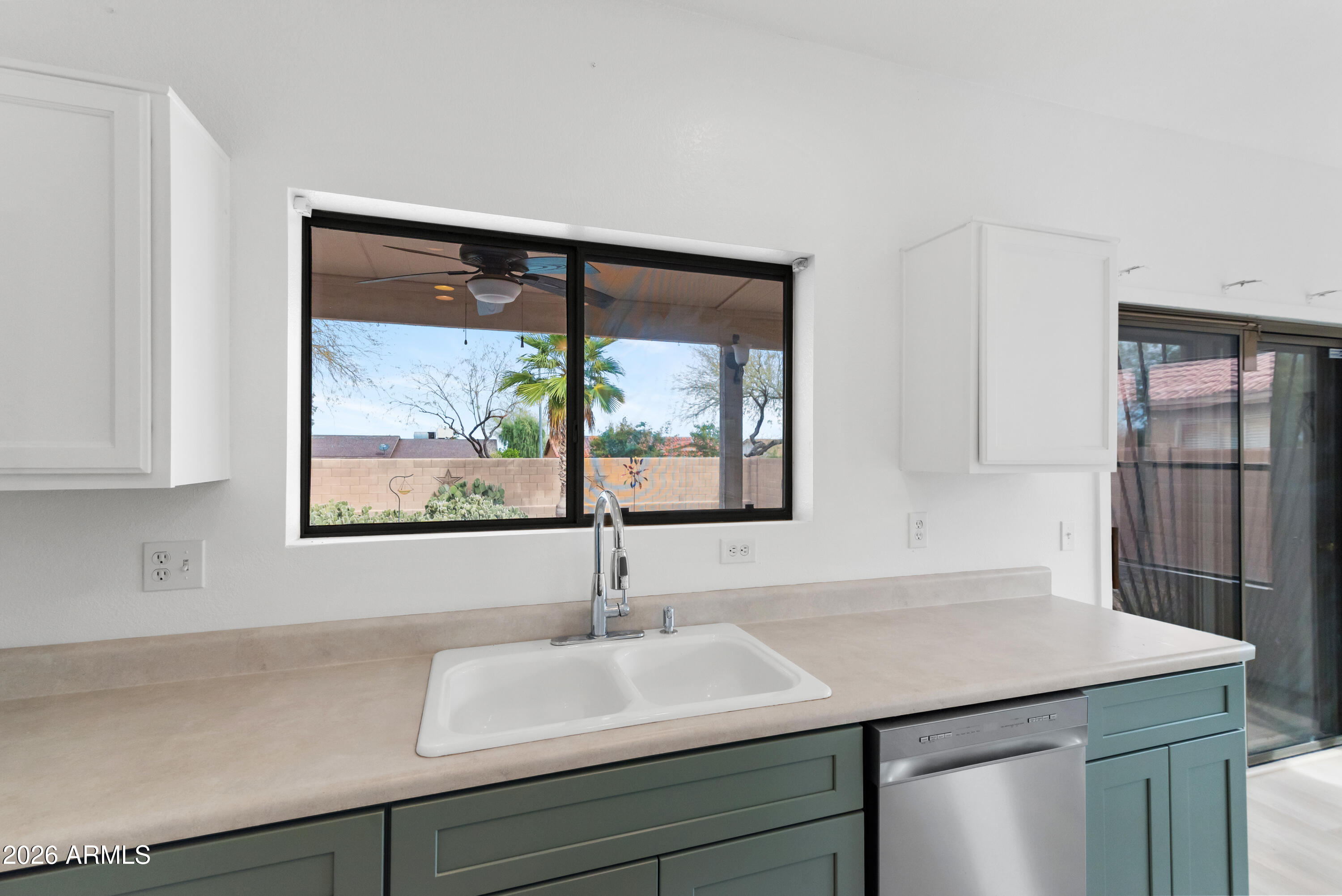 930 East Pedro Road Phoenix, AZ 85042 - Photo 12 of 34 a bathroom with a sink and a large mirror
