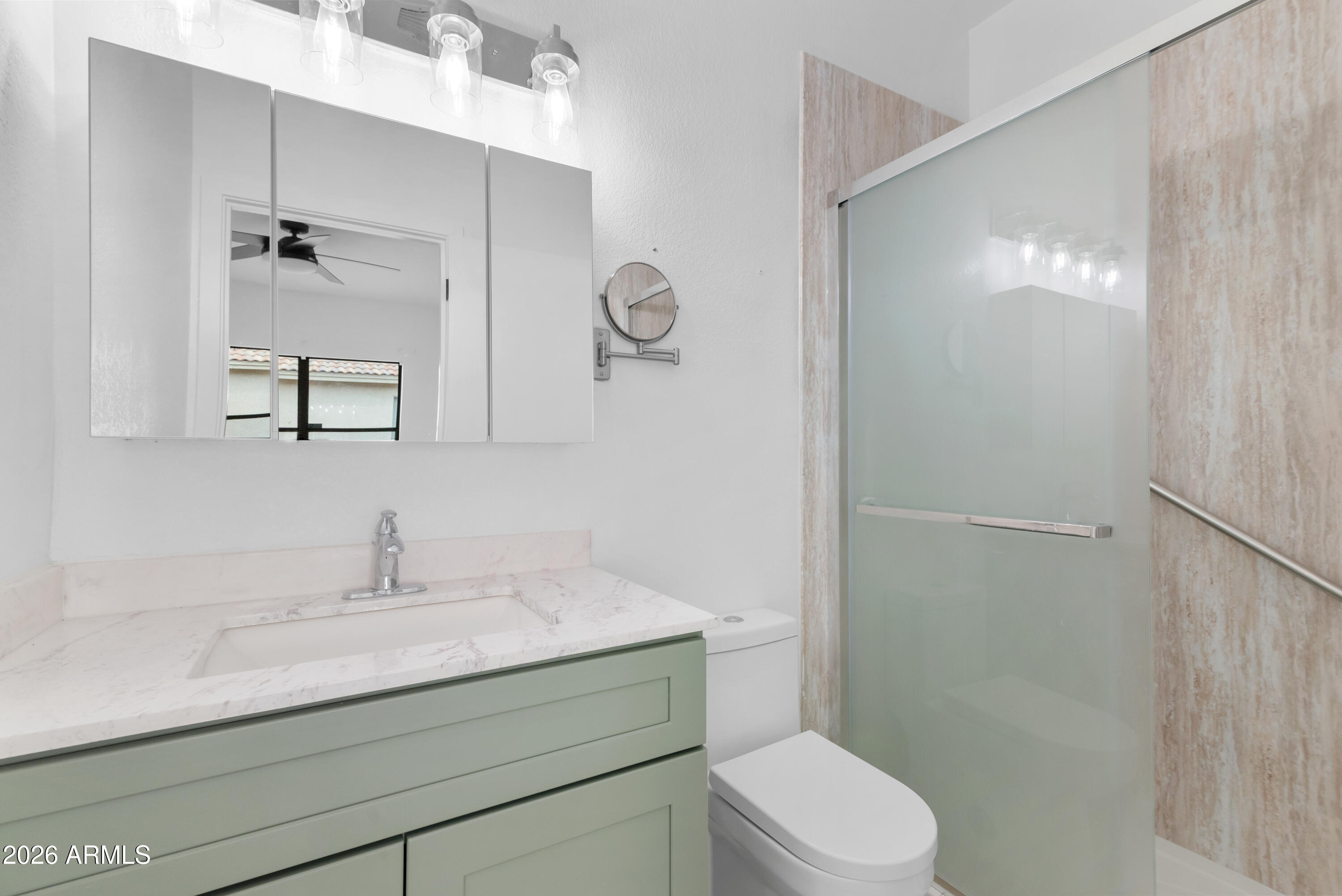 930 East Pedro Road Phoenix, AZ 85042 - Photo 18 of 34 a bathroom with a sink a toilet and shower