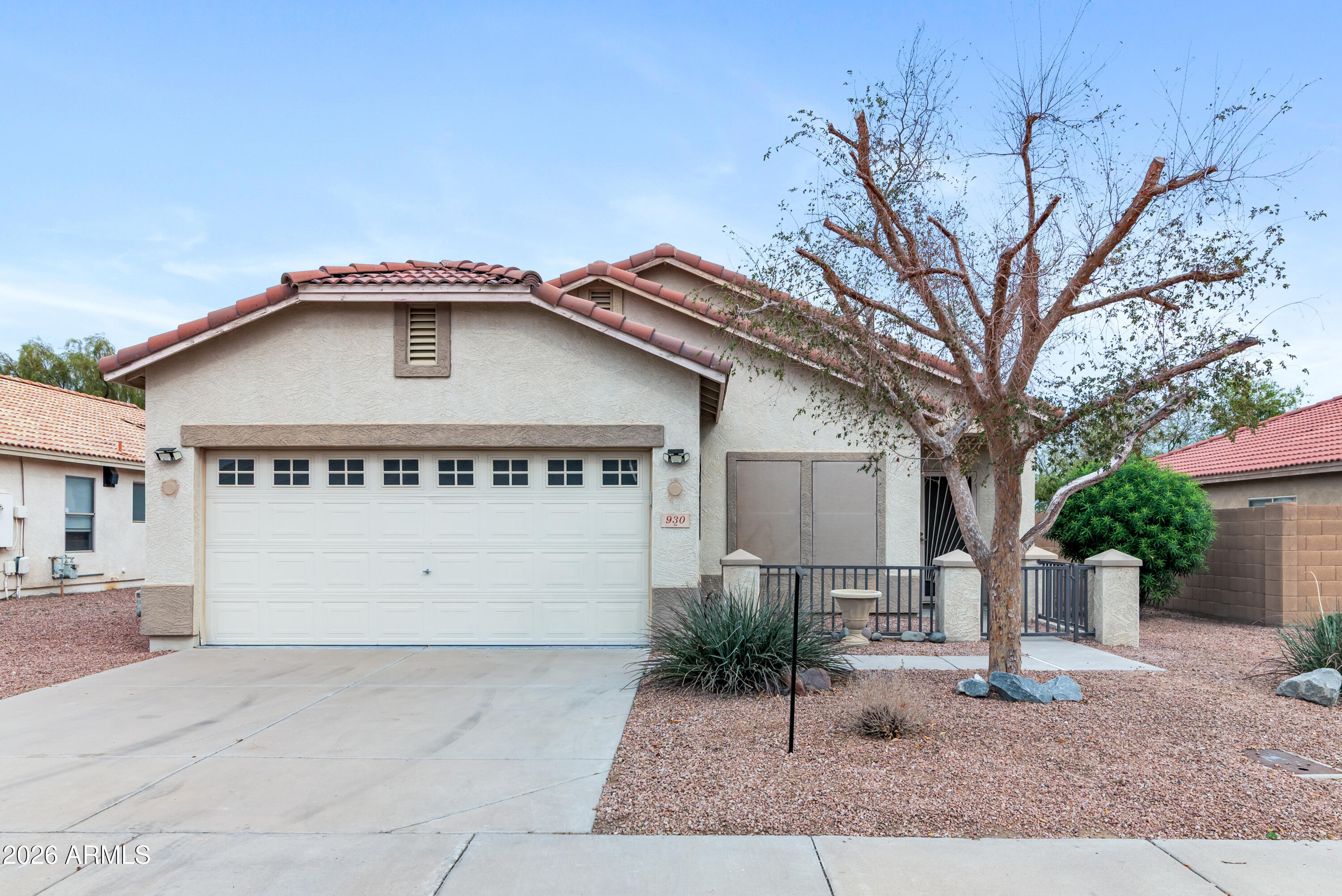 930 East Pedro Road Phoenix, AZ 85042 - Photo 2 of 34 a view of a house with a yard