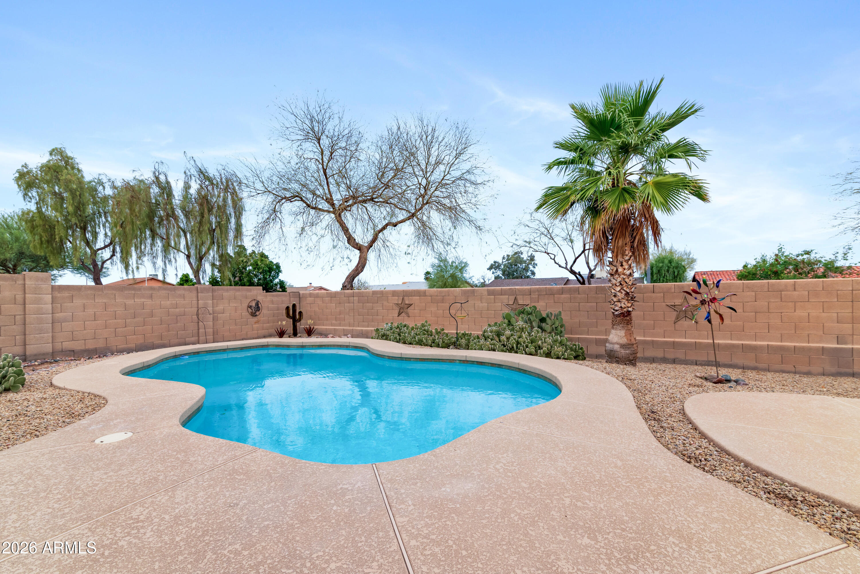 930 East Pedro Road Phoenix, AZ 85042 - Photo 26 of 34 a view of a swimming pool with a yard