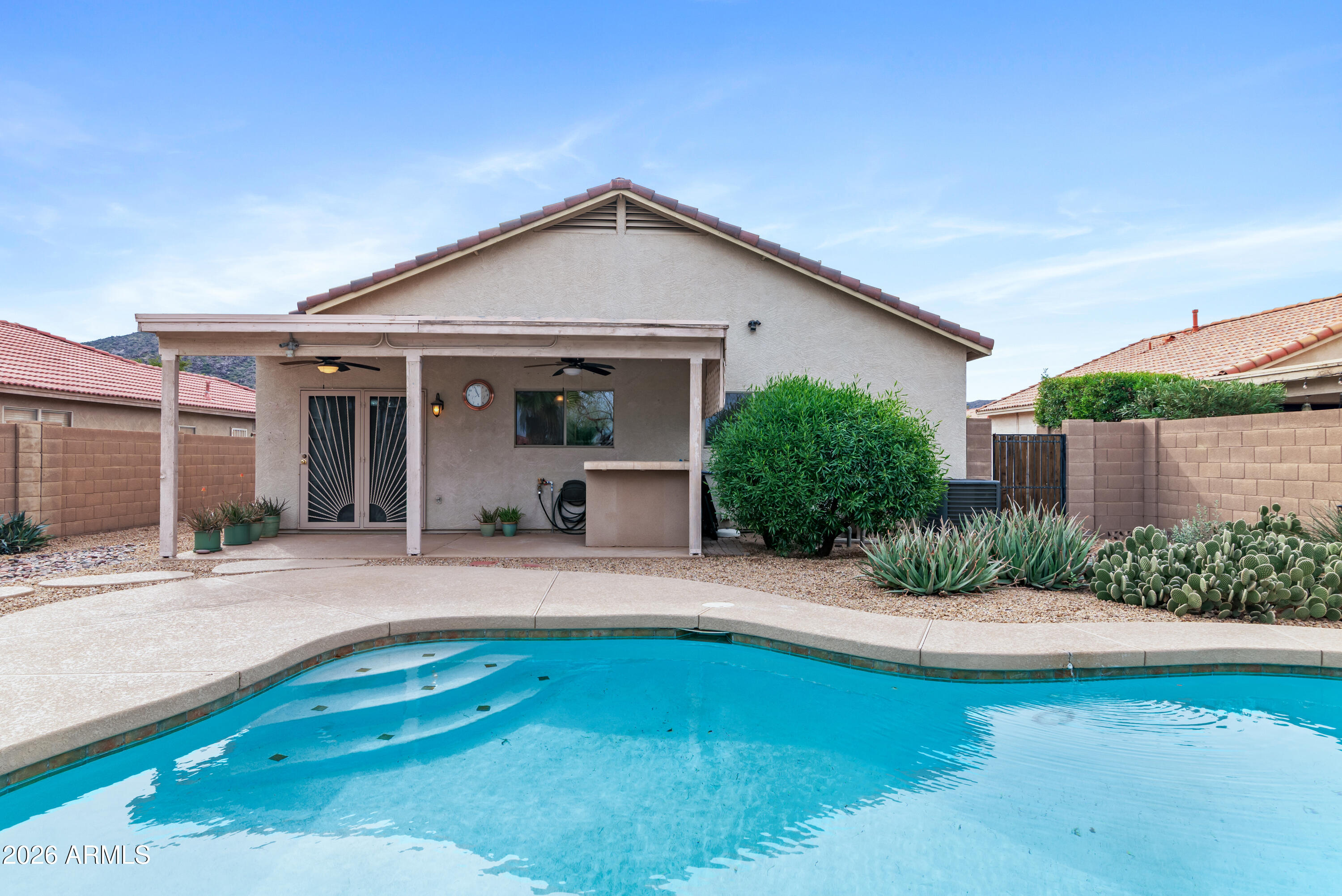 930 East Pedro Road Phoenix, AZ 85042 - Photo 3 of 34 front view of a house with a yard