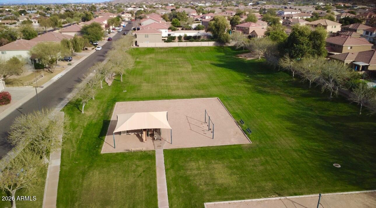 930 East Pedro Road Phoenix, AZ 85042 - Photo 31 of 34 an aerial view of residential houses with outdoor space and trees