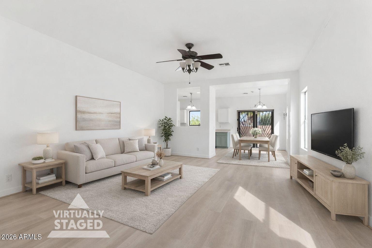 930 East Pedro Road Phoenix, AZ 85042 - Photo 4 of 34 a living room with furniture and a flat screen tv