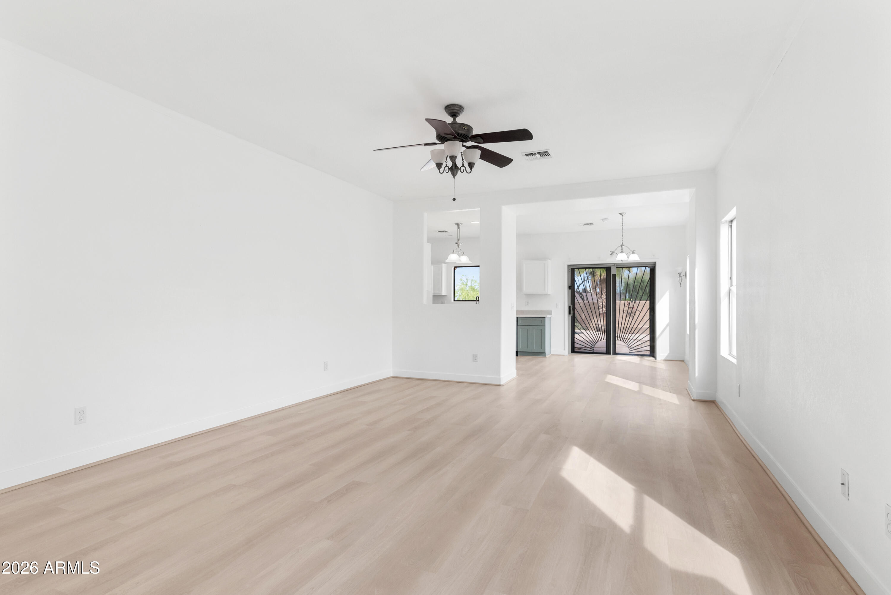 930 East Pedro Road Phoenix, AZ 85042 - Photo 5 of 34 a view of an empty room with a window