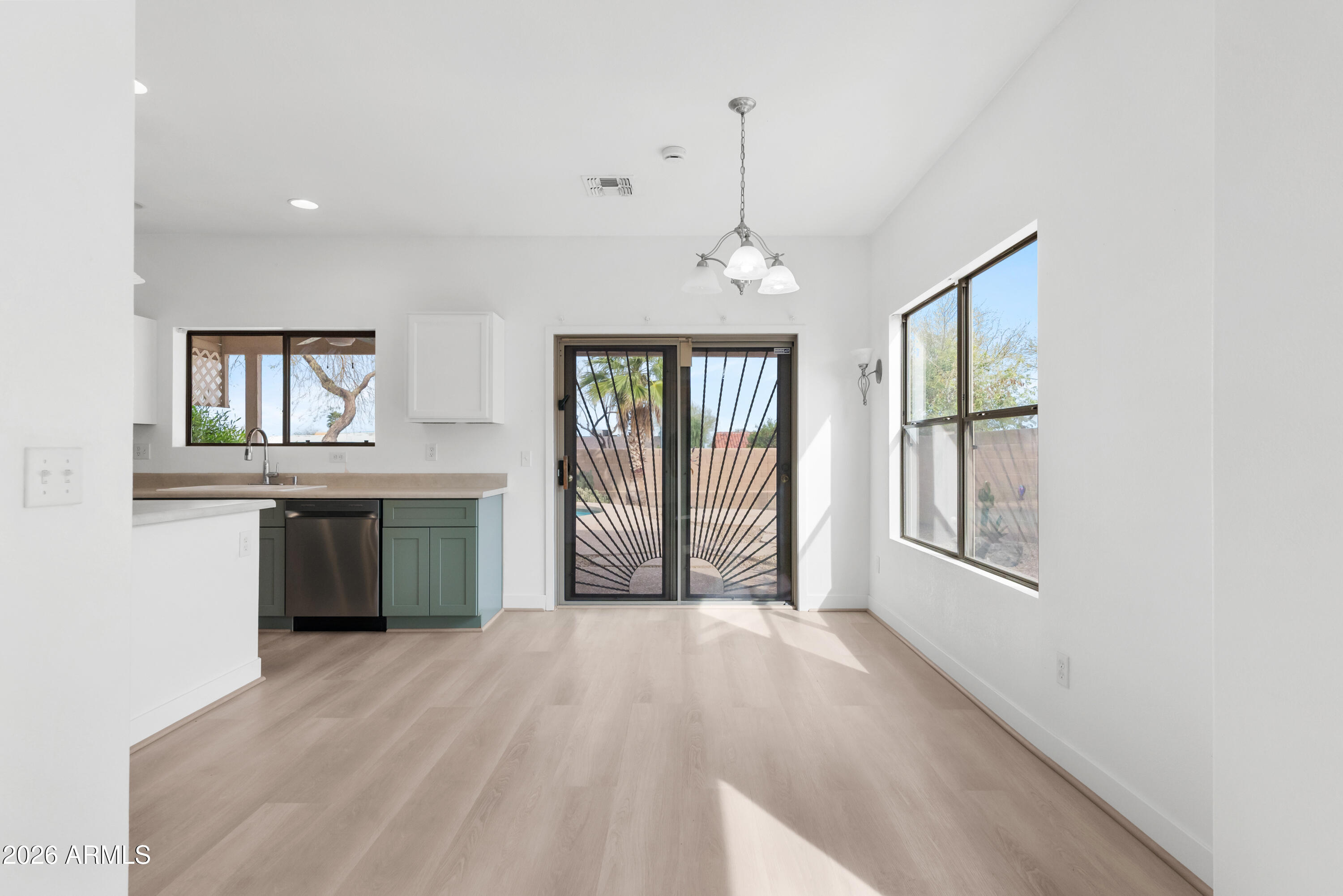 930 East Pedro Road Phoenix, AZ 85042 - Photo 8 of 34 a view of an empty room with a window and dresser
