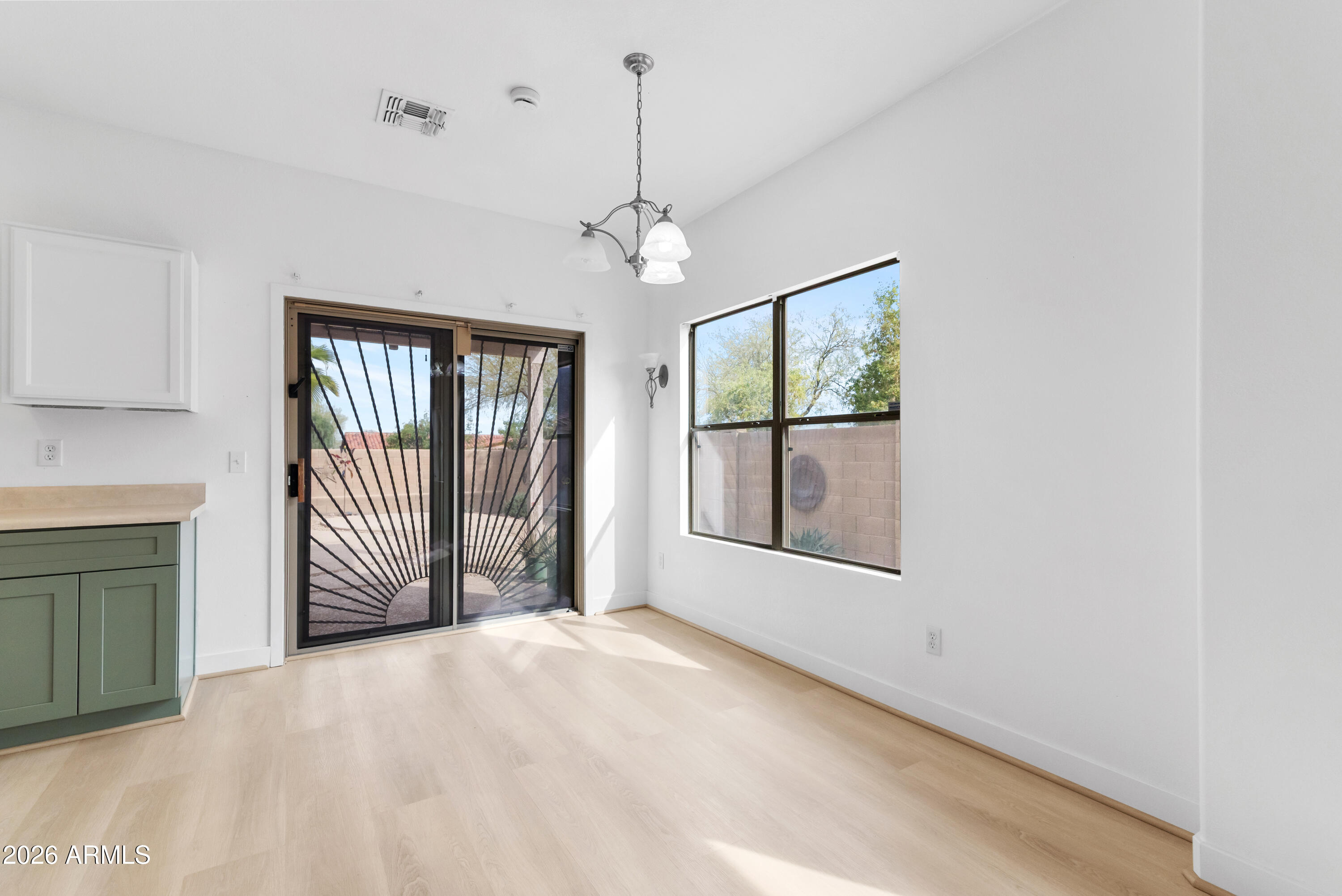 930 East Pedro Road Phoenix, AZ 85042 - Photo 9 of 34 a view of an empty room with a window
