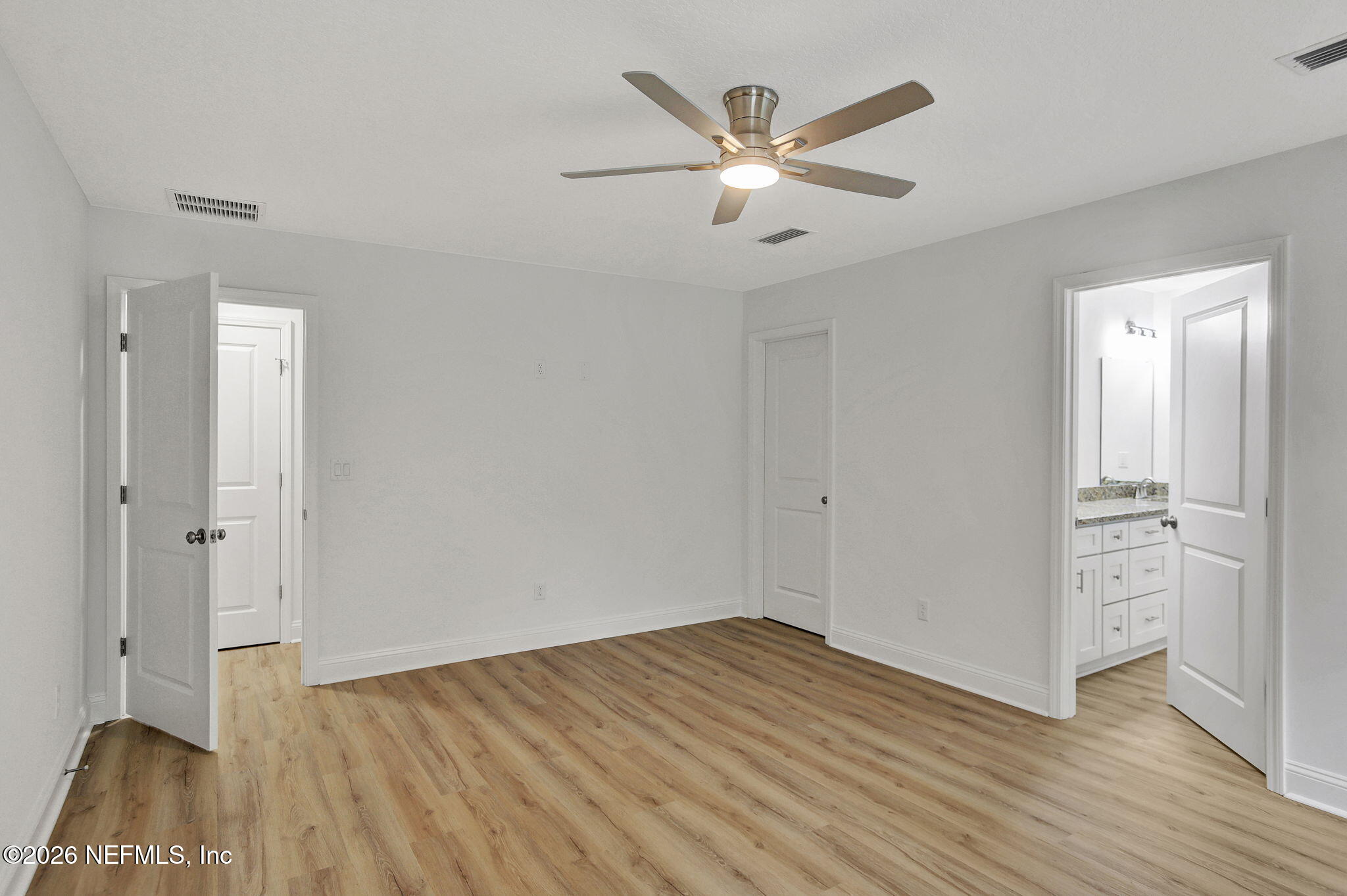 4881 Chickpea Street Middleburg, FL 32068 - Photo 12 of 19 wooden floor in an empty room with a window