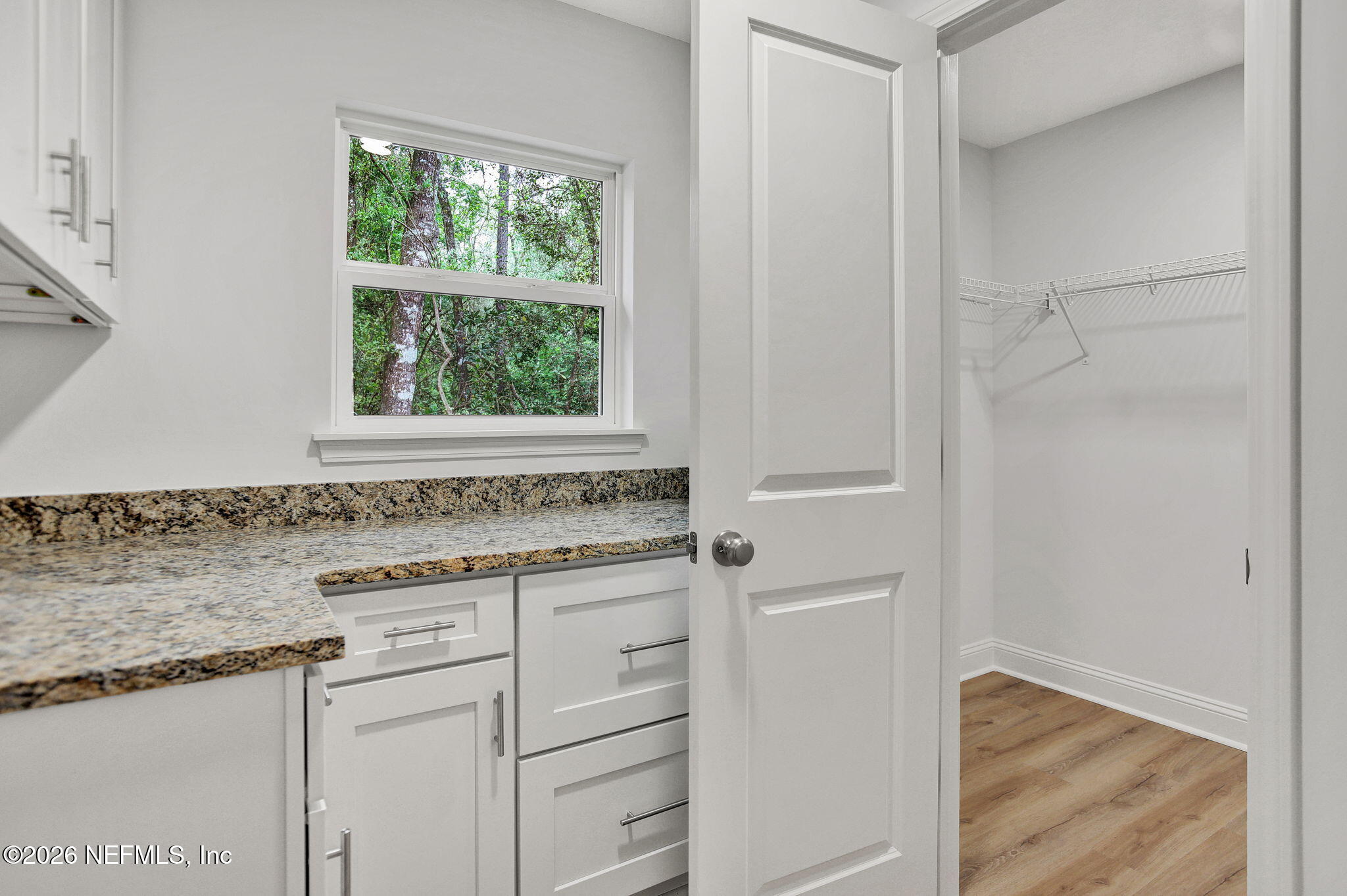 4881 Chickpea Street Middleburg, FL 32068 - Photo 14 of 19 a bathroom with a granite countertop sink and a window