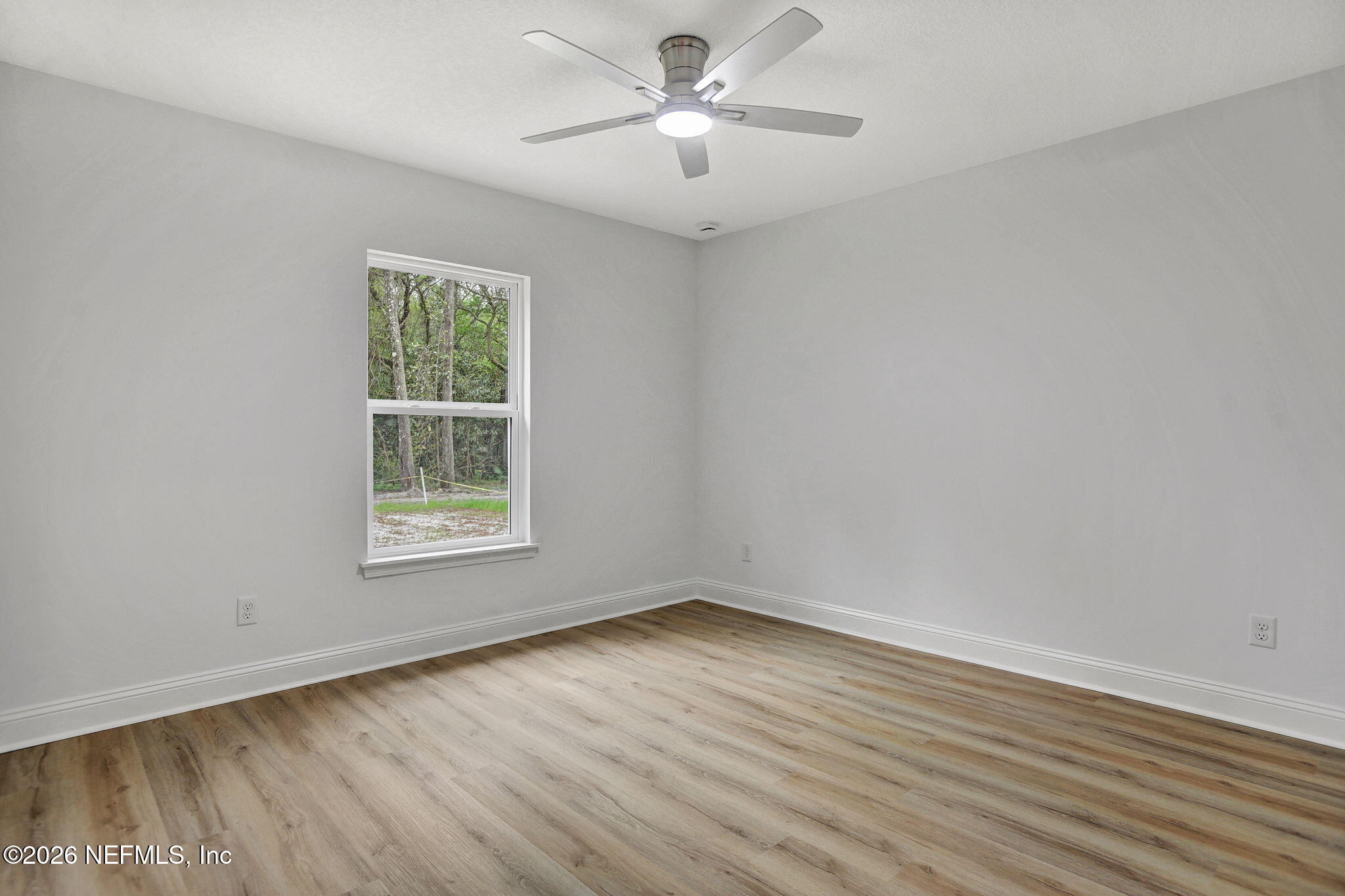 4881 Chickpea Street Middleburg, FL 32068 - Photo 15 of 19 wooden floor in an empty room with a window