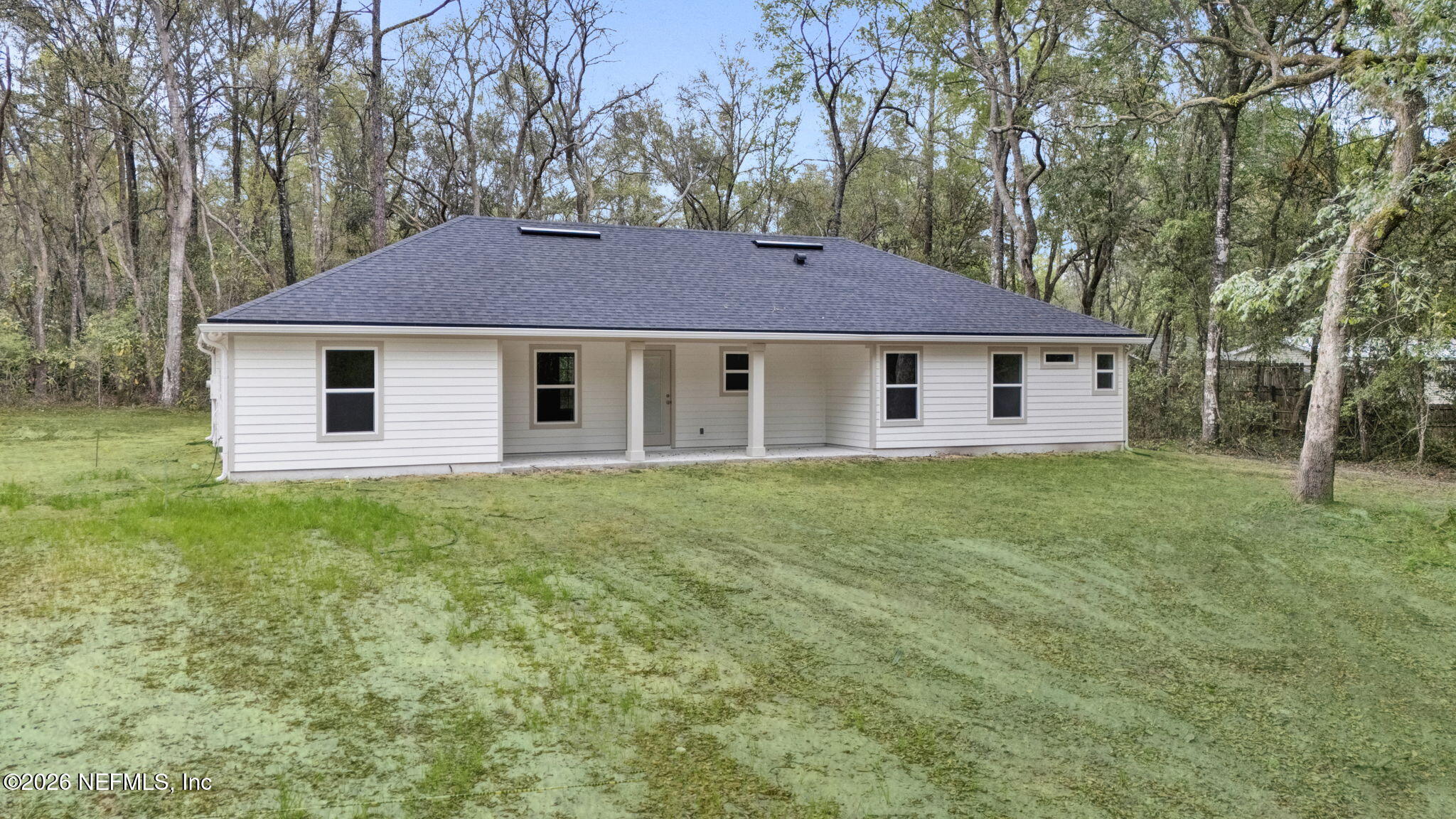 4881 Chickpea Street Middleburg, FL 32068 - Photo 19 of 19 a view of a house with a yard