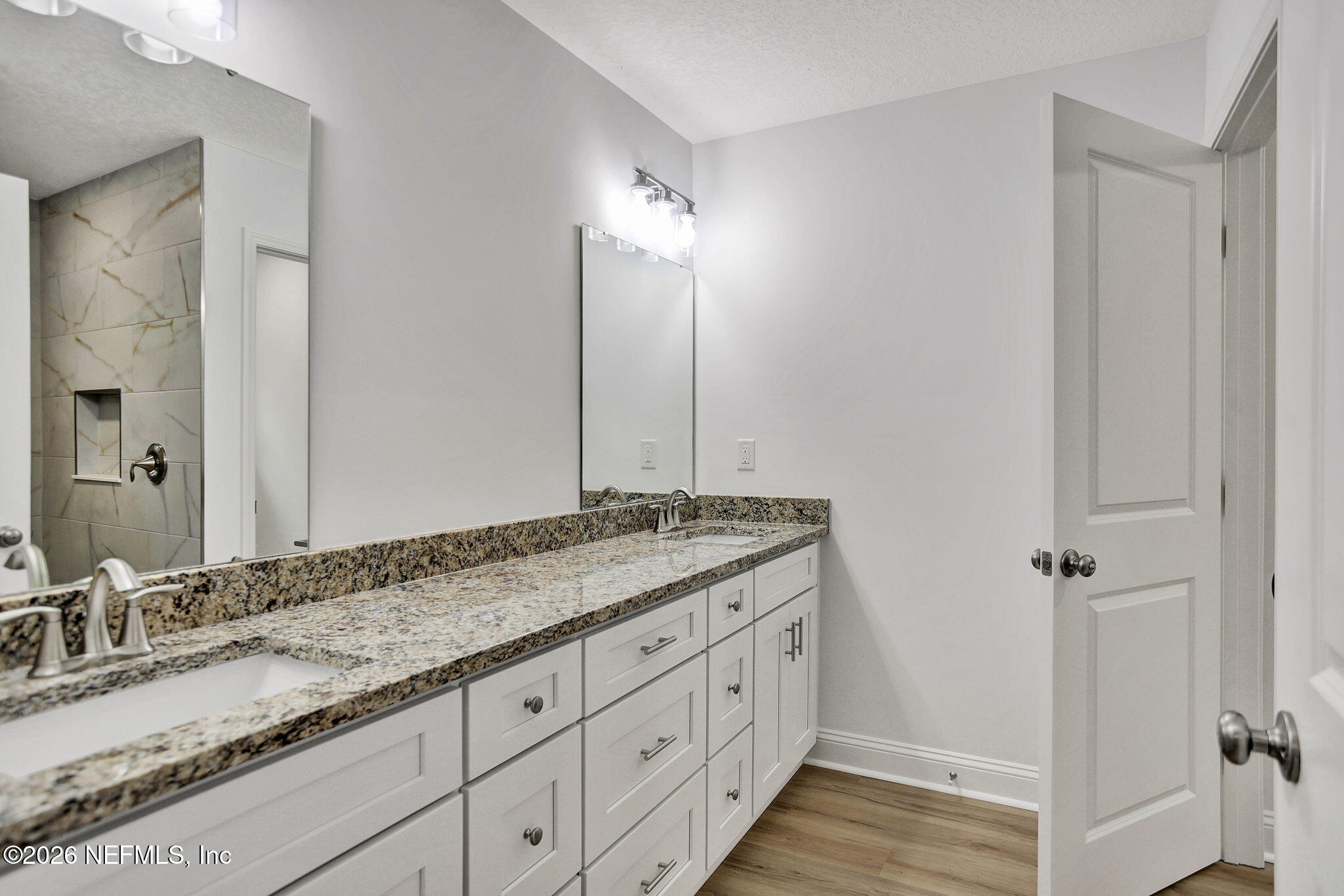 4881 Chickpea Street Middleburg, FL 32068 - Photo 10 of 19 a bathroom with a granite countertop sink and a mirror