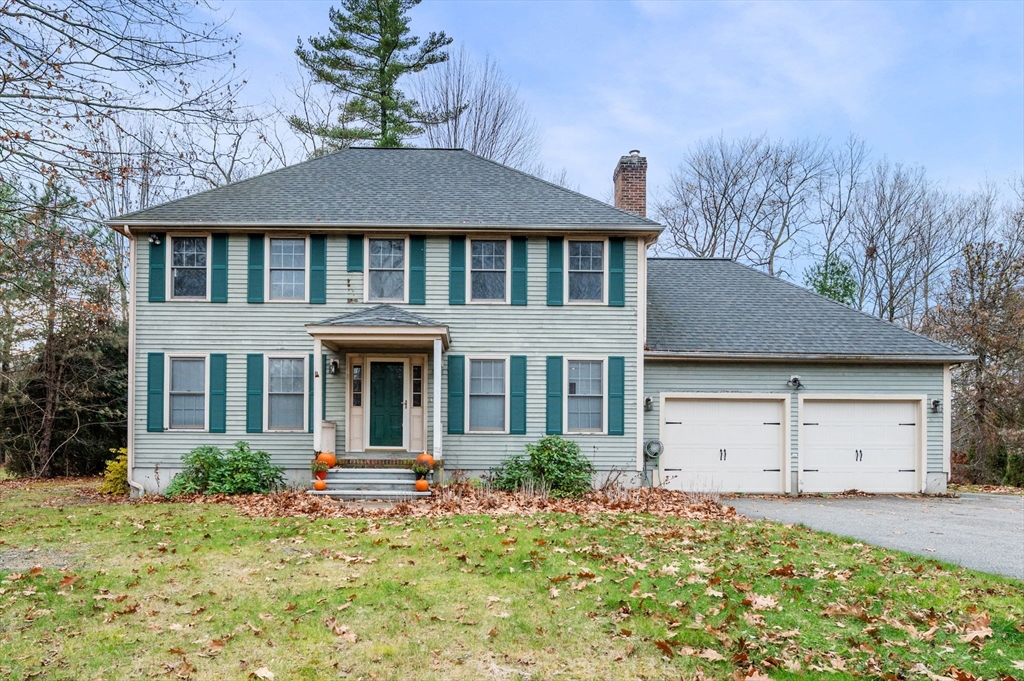 328 East Broadway Haverhill, MA 01830 - Photo 1 of 37 a front view of a house with a yard and garage