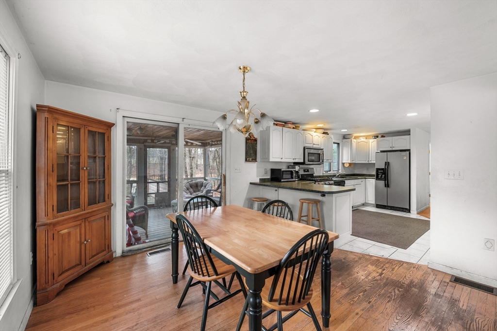 328 East Broadway Haverhill, MA 01830 - Photo 14 of 37 a kitchen with a table and chairs in it