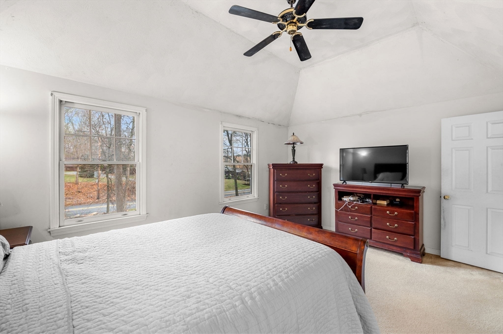 328 East Broadway Haverhill, MA 01830 - Photo 20 of 37 a bedroom with a bed and flat screen tv