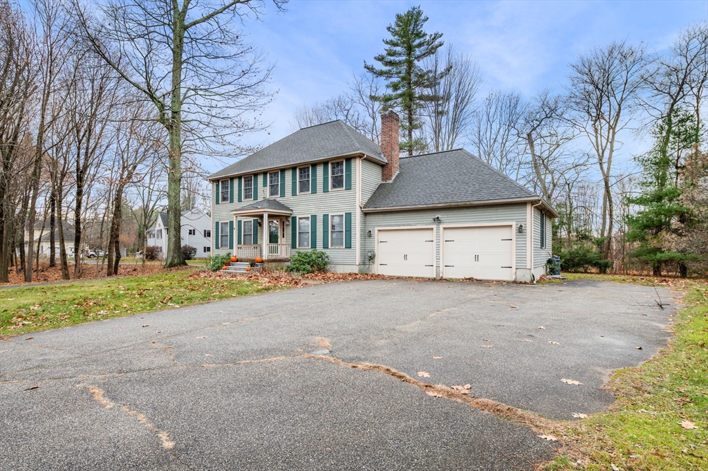 328 East Broadway Haverhill, MA 01830 - Photo 2 of 37 a front view of a house with a yard and garage