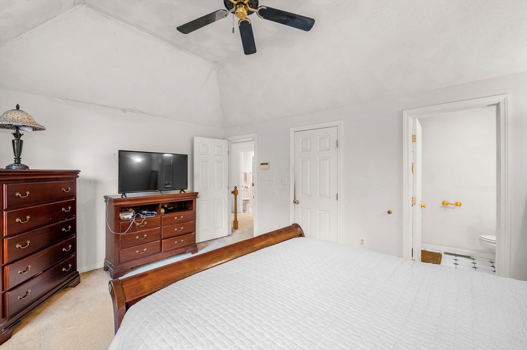 328 East Broadway Haverhill, MA 01830 - Photo 21 of 37 a bedroom with a bed and a flat screen tv