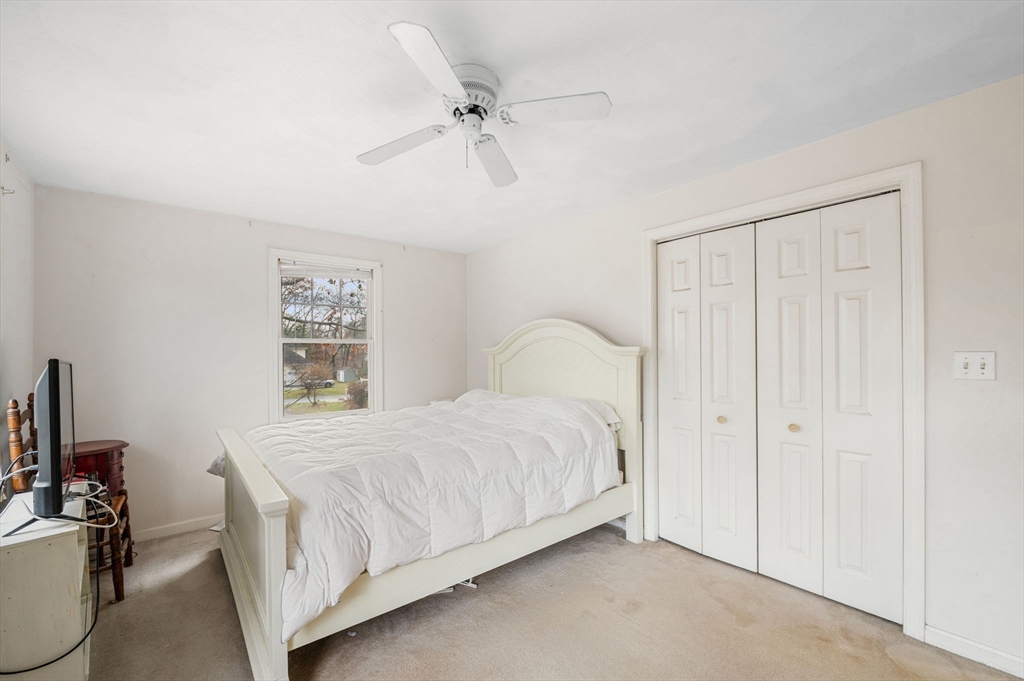 328 East Broadway Haverhill, MA 01830 - Photo 25 of 37 a bedroom with a bed and a table