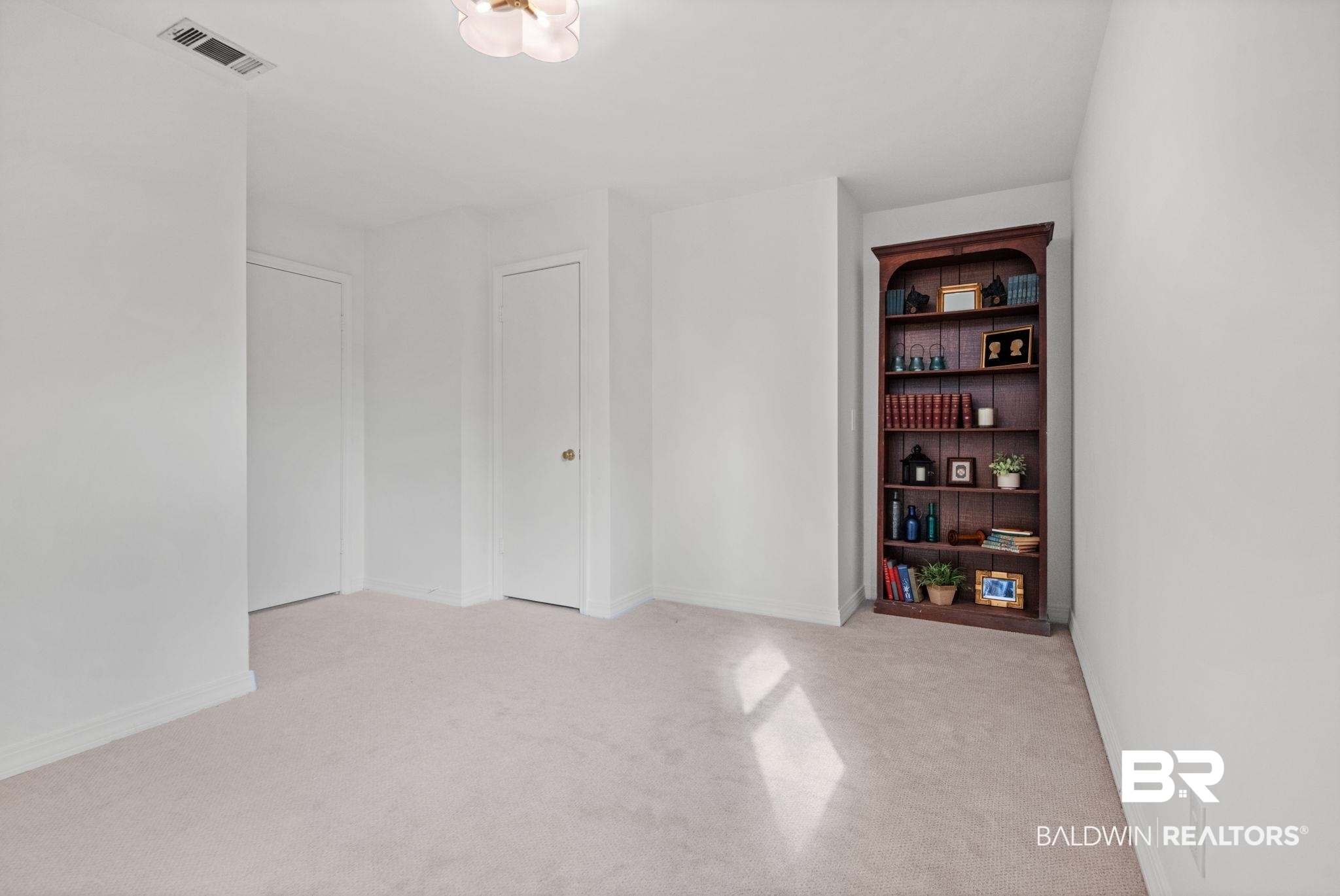 511 Wacker Lane North Mobile, AL 36608 - Photo 27 of 45 Unfurnished room featuring light colored carpet and baseboards