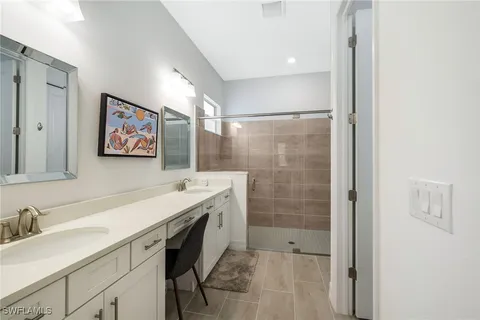 a bedroom with a bed and a potted plant