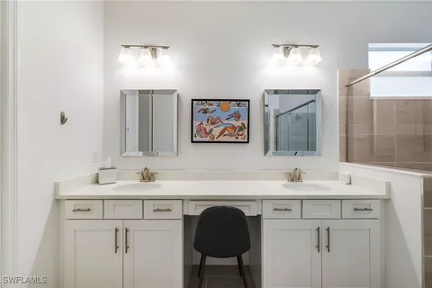 a bathroom with a sink toilet and mirror