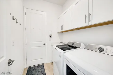 an aerial view of a swimming pool with a lake view