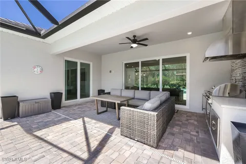 a group of people sitting at tables in a living room