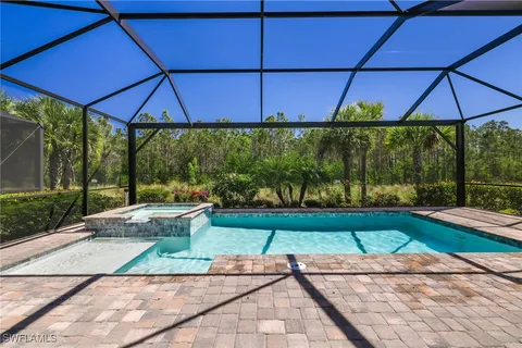 a view of a hallway with entryway wooden floor and front door