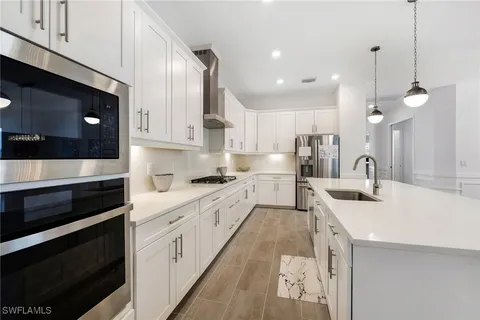 a bedroom with bed and windows