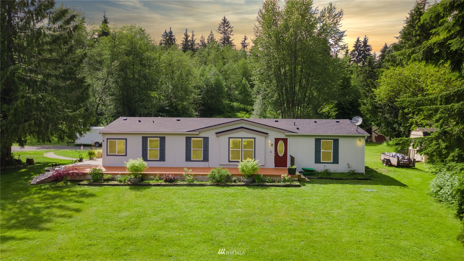 16227 OK Mill Road Snohomish, WA 98290 - Photo 1 of 38 a front view of a house with a garden
