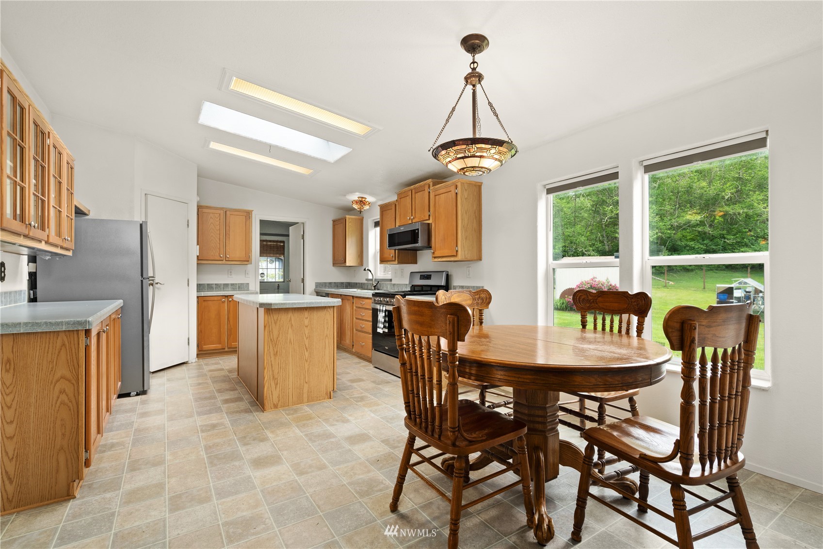 16227 OK Mill Road Snohomish, WA 98290 - Photo 13 of 38 a view of a dining room with furniture window and outside view