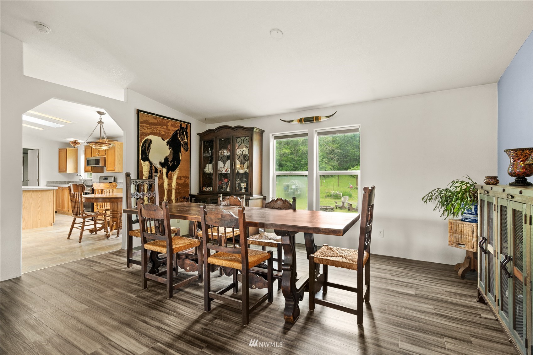 16227 OK Mill Road Snohomish, WA 98290 - Photo 19 of 38 a view of a dining room with furniture window and wooden floor
