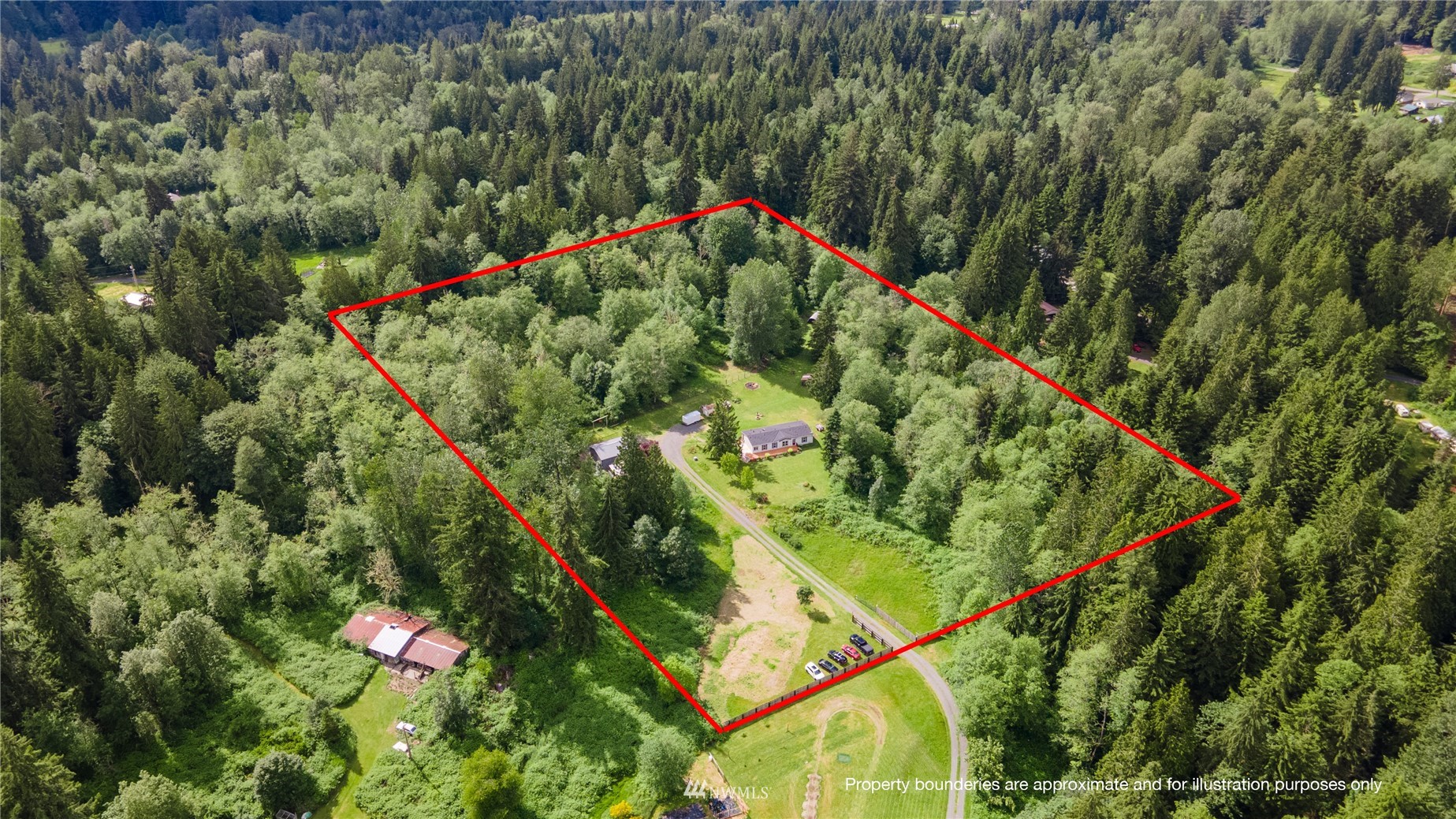 16227 OK Mill Road Snohomish, WA 98290 - Photo 2 of 38 a backyard of a house with lots of green space