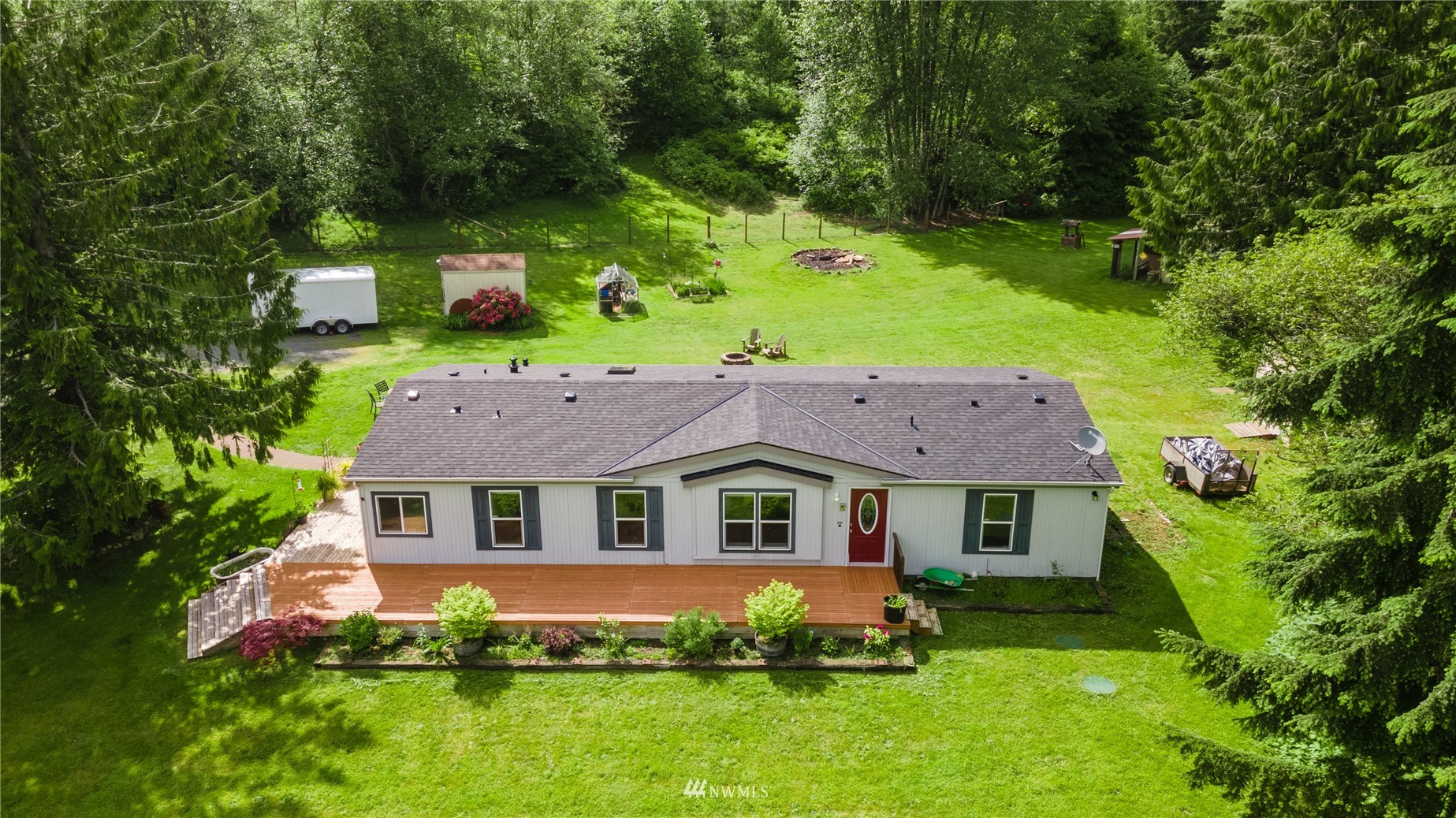 16227 OK Mill Road Snohomish, WA 98290 - Photo 3 of 38 a aerial view of a house with a yard table and chairs