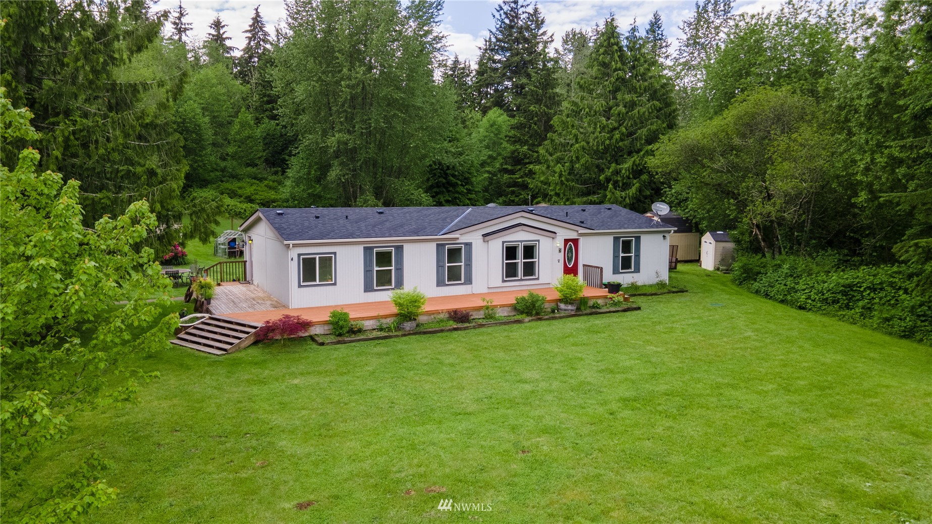 16227 OK Mill Road Snohomish, WA 98290 - Photo 34 of 38 a front view of a house with a garden