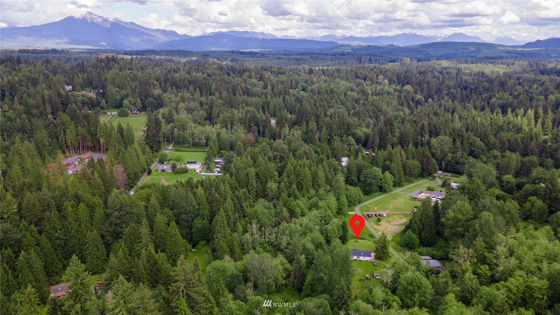 16227 OK Mill Road Snohomish, WA 98290 - Photo 37 of 38 a view of a lush green hillside and a houses