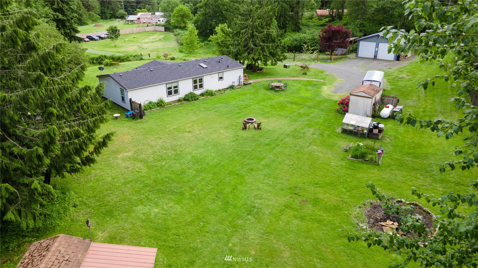 16227 OK Mill Road Snohomish, WA 98290 - Photo 4 of 38 an aerial view of a house with pool yard and outdoor seating