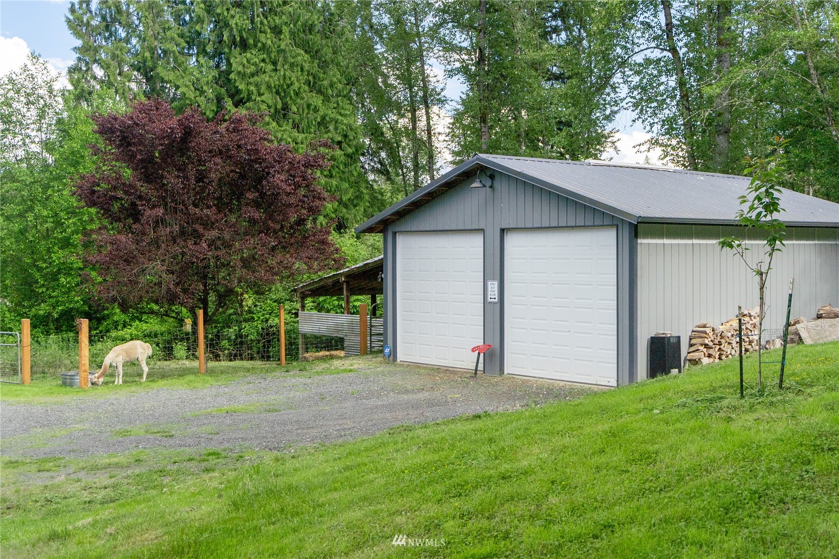 16227 OK Mill Road Snohomish, WA 98290 - Photo 6 of 38 a front view of house with yard and trees in the background