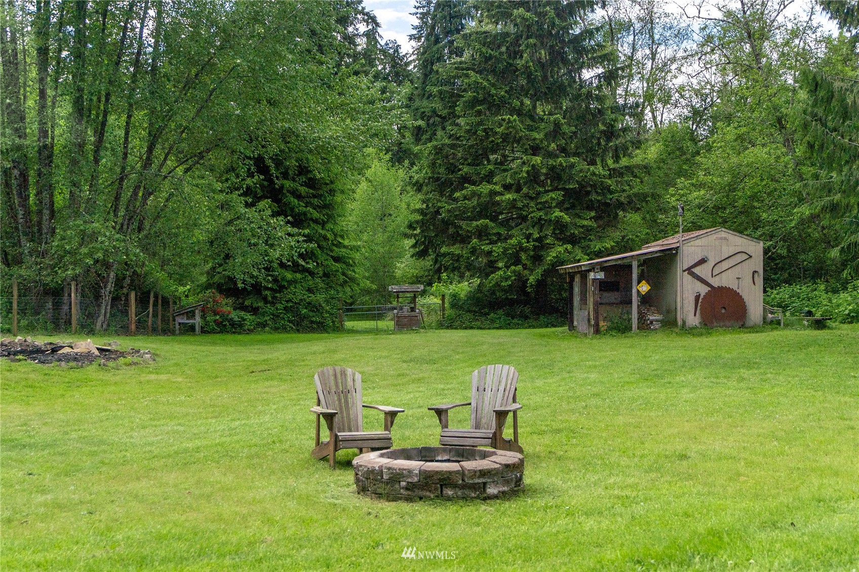 16227 OK Mill Road Snohomish, WA 98290 - Photo 7 of 38 a front view of a house with a yard table and chairs