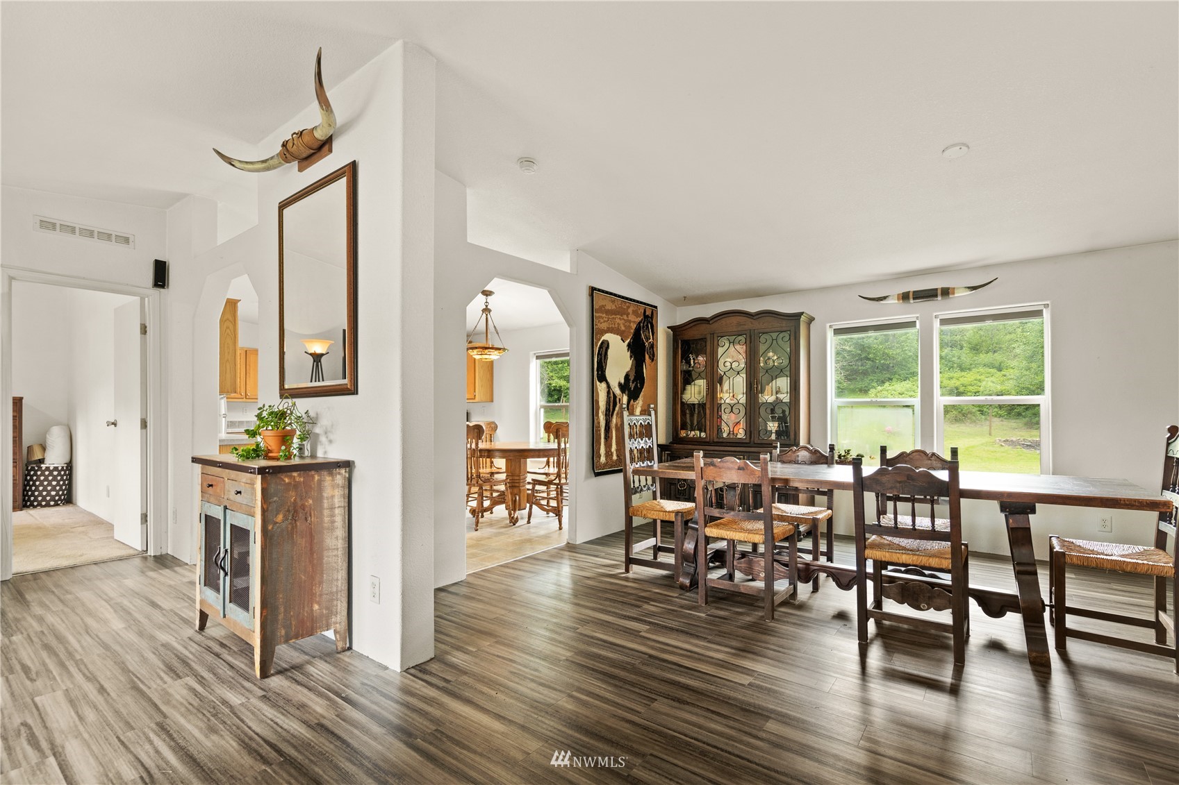16227 OK Mill Road Snohomish, WA 98290 - Photo 10 of 38 a view of a dining room with furniture window and wooden floor