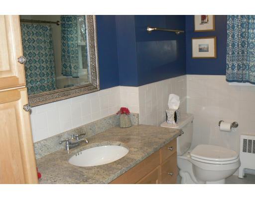 35 Colgate Road Newton, MA 02462 - Photo 12 of 17 a bathroom with a granite countertop sink mirror vanity and toilet