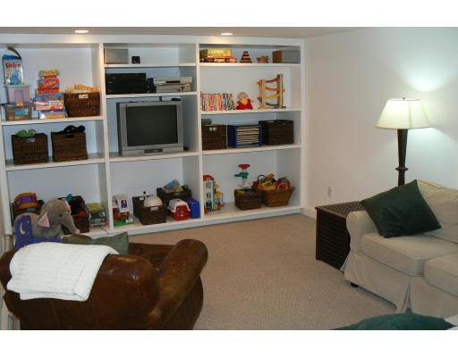 35 Colgate Road Newton, MA 02462 - Photo 13 of 17 a living room with furniture and a flat screen tv