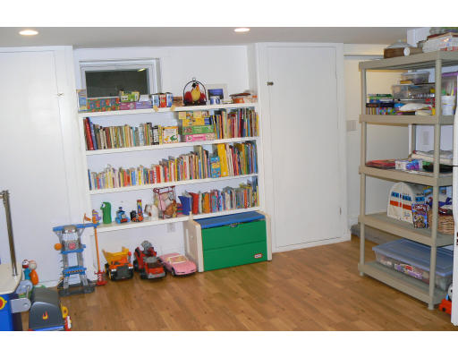 35 Colgate Road Newton, MA 02462 - Photo 14 of 17 a room with furniture and book shelf