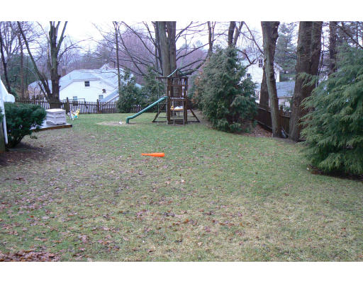 35 Colgate Road Newton, MA 02462 - Photo 15 of 17 a backyard of apartments with large trees